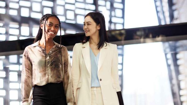 Two women walking through the University of Technology Sydney Faculty of Engineering and IT building