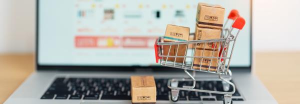 Boxes with shopping cart on a laptop computer