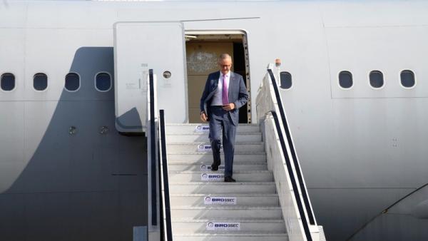 Anthony Albanese descending plane stairs