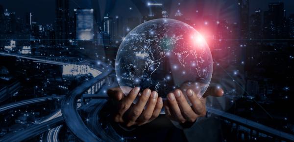 Hands hold a transparent globe, digital highways cascade into darkness