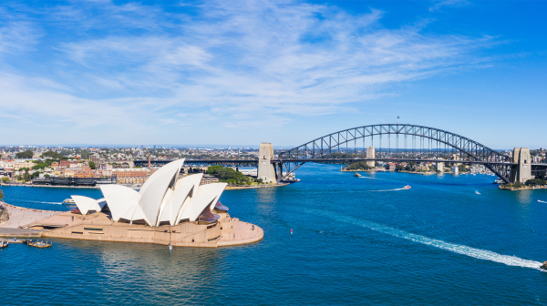 Sydney Opera House and harbour with blue sky