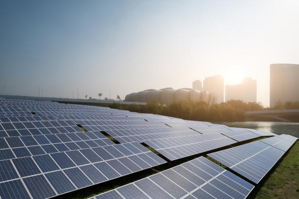 Solar Panels in Urban Landscape at Sunrise