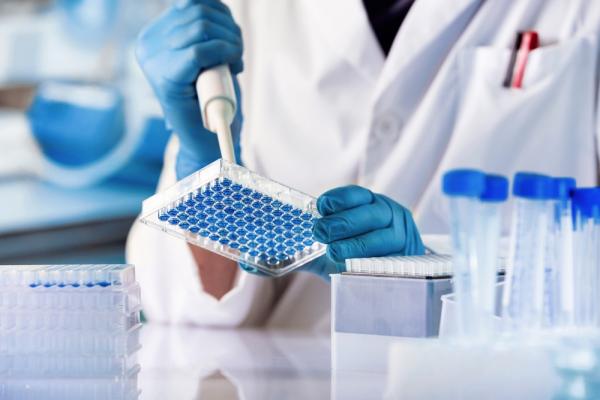 Researcher working in genetics laboratory