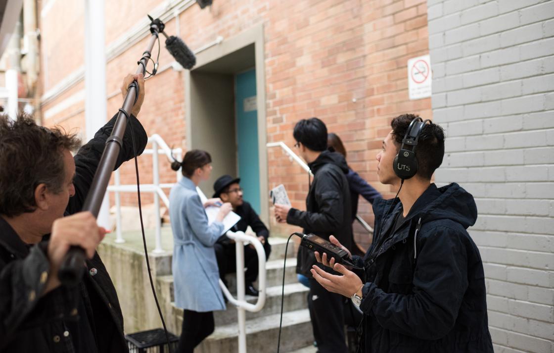 A group of students using sound recording equipment