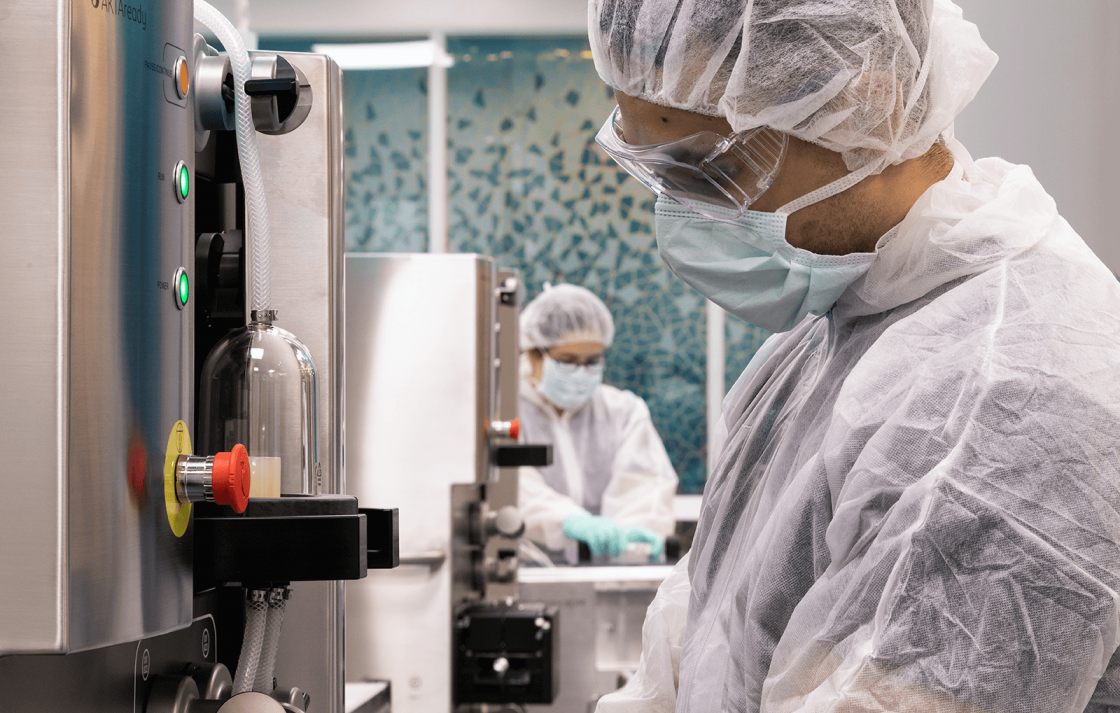 Two researchers working in the Biologics Innovation Facility at UTS