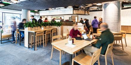 People sitting at table and chairs at the Terrace cafe 