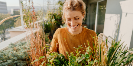 Woman in urban environment surrounded by greenery