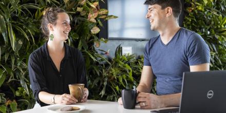 Two ISF staff in conversation