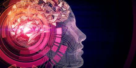 Geometric human head in tones of pink through orange on a dark background