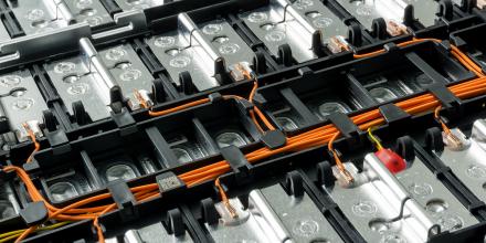 Electric car lithium battery pack with orange wiring connections between cells