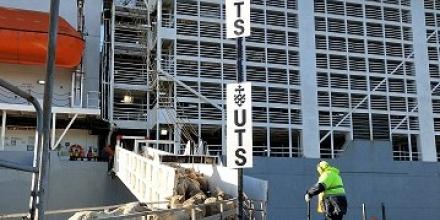 Photo of sheep boarding a ship
