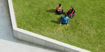 Students socialising and relaxing at UTS alumni green