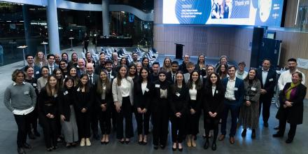 Large group of participants pose at the Law Tech Challenge