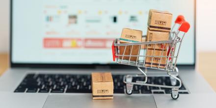 Boxes with shopping cart on a laptop computer