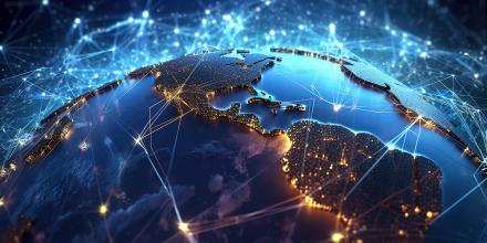 A blue globe with countries shown lit at night with network lines between them indicating interlinkages