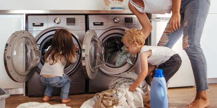 Photo of family packing washing machine