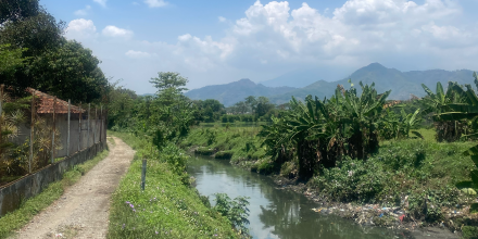 Pond with mountains in the background in Indonesia.