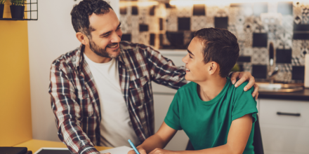 Father with son doing homework