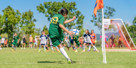 Girl kicking a soccer ball