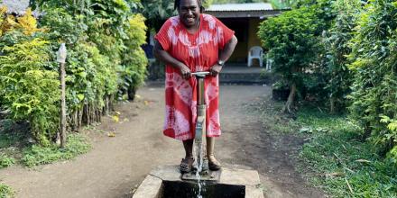 Local Fijian woman pumping groundwater.