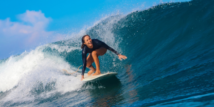 Woman surfing in the ocean