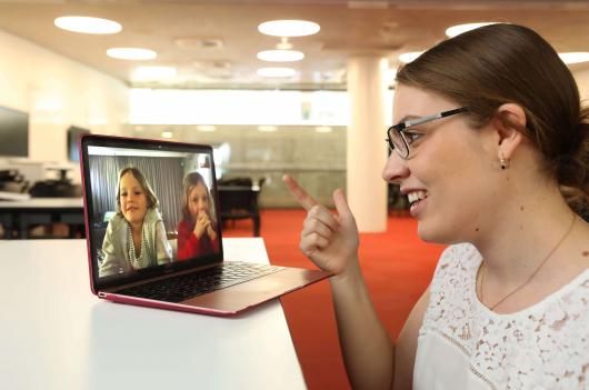 GSH About Speech Pathology - student looking at children on computer