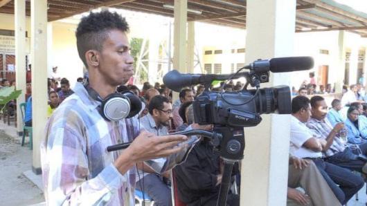 Students using the cameras in East Timor