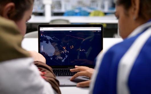 students look at a computer screen