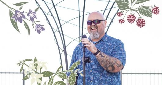 Yerrabingin founder Christian Hampson, with illustrations of edible native plants from the farm.