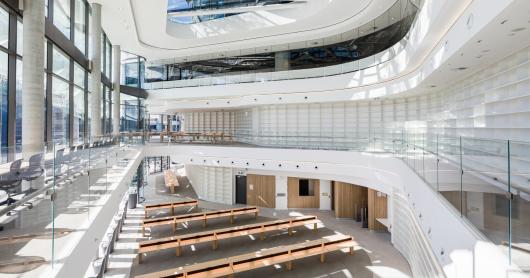 The Reading Room in UTS Central, featuring large glass windows and rows of desks along a wall of books.