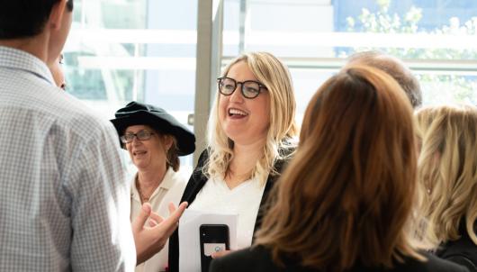 UTS DAB alumna Louise Vlatko mingling with graduation ceremony guests