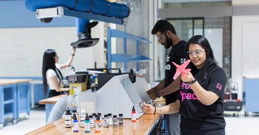 Three students at work in the UTS ProtoSpace