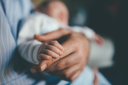 Baby's hand in focus