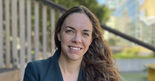 a woman smiling at the camera