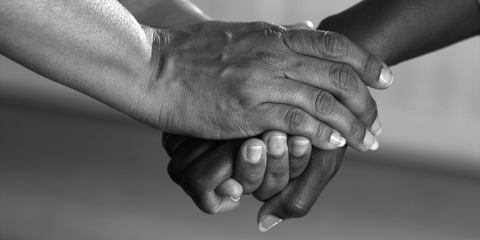 Two people holding hands.