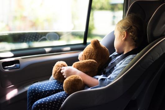 child asleep in car seat