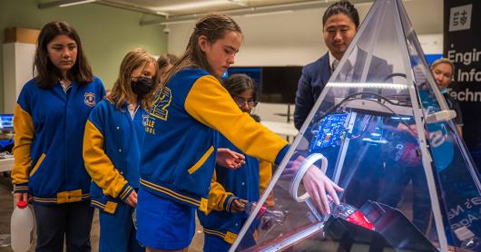 School students and Dr Xu Wang with the Smart Bin at UTS Internet of Things lab