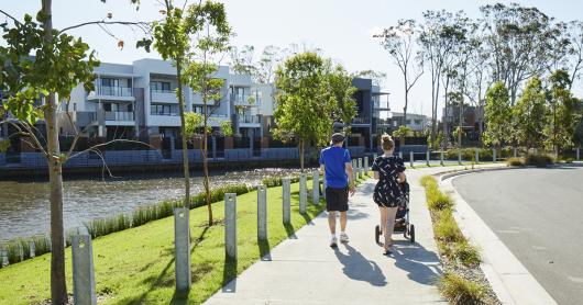 two people walk along a pathway