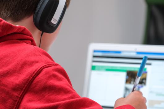 Child with computer. Unsplash