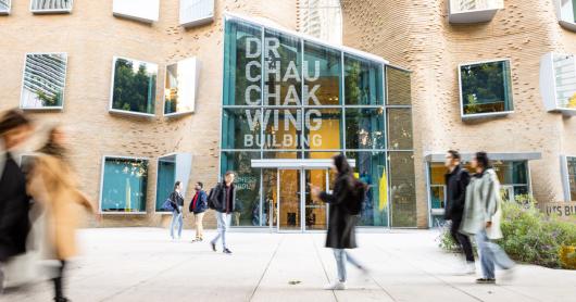 Students walking past the entry to UTS Business School