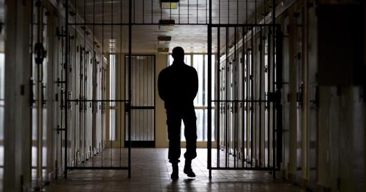 A warden patrols in the corridors of the Bois d'Arcy jail on July 8, 2014, near Paris.