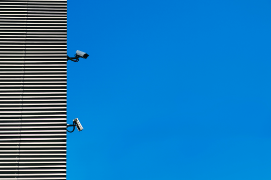 A building with two CCTV cameras