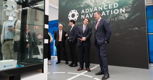 Malcolm Turnbull and Ed Husic with the founders of Advanced Navigation as they stand near an underwater drone display.