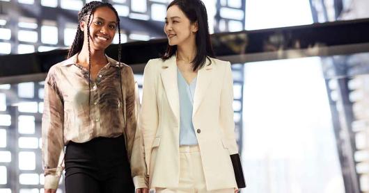 Two women walking through the University of Technology Sydney Faculty of Engineering and IT building