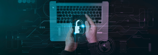 Hands holding padlock over laptop