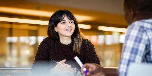 UTS PhD student Somayeh Sadegh Koohestani chatting with another student