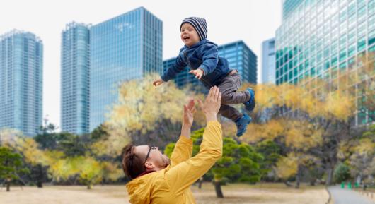 baby in a city park with dad