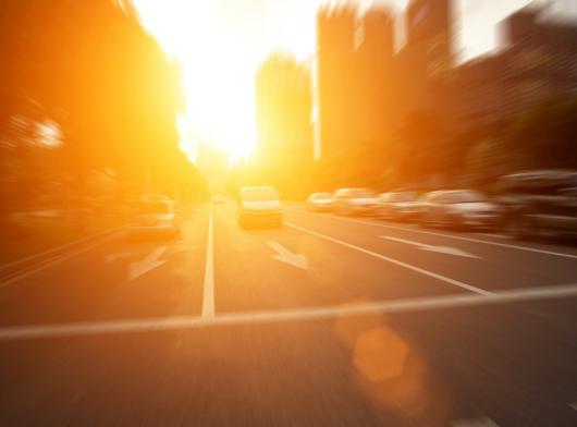 Stock picture of bright sun beating down of a city street