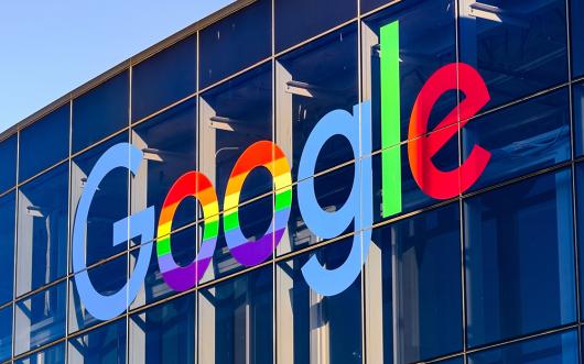 Picture: Adobe Stock. June 8, 2019 Mountain View / CA / USA - Google office building in the Company's campus in Silicon Valley; The "double o's" of the logo are decorated in rainbow colours in honour of LGBTQ Rights