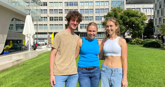 Three students on the Alumni Green